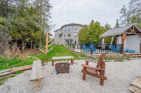 The firepit along the water is perfect for enjoying a cozy summer night.