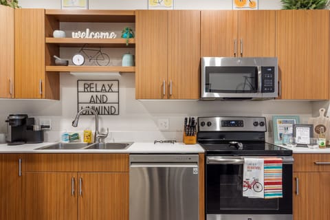 Well-equipped kitchen w/ stove, microwave, coffee maker & ample counter space.