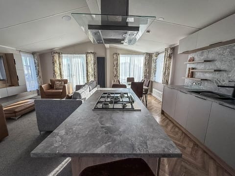 Spacious open-concept kitchen and living area with natural light