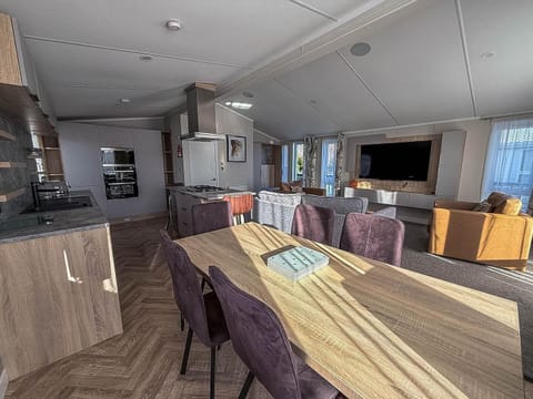 Spacious open-concept kitchen and dining area with natural light