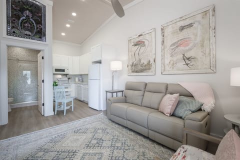 Comfortable Living Space with Italian Leather Couch adjacent to the kitchen