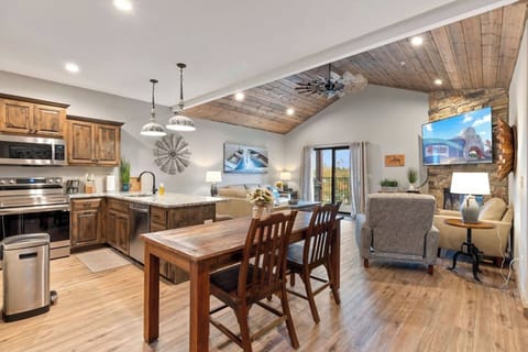 Plenty of seating in the living room along with a great view of the pool and lake on the deck. There are 6 chairs at the dining room table.