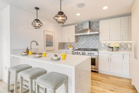 Each space features a kitchen.