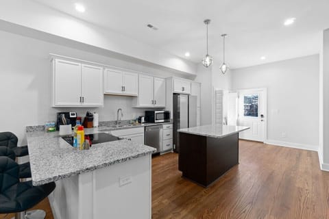 Full Kitchen w/ Granite Countertop, Stainless Finishes, & Hardwood Floors