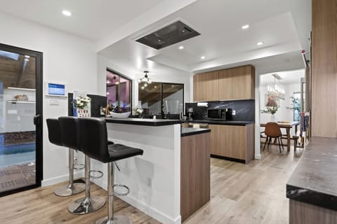 Kitchen with barstool seating.