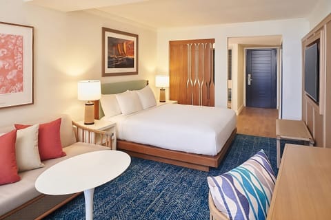 Unwind in a plush bed with warm, calming lighting.