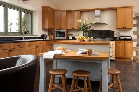East Lodge, Yorkshire - breakfast bar and the expansive kitchen island; perfect for convivial cooking