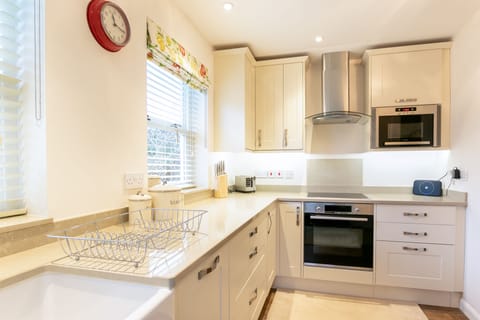 Integrated appliances in designer kitchen makes booking and clean-up easy.