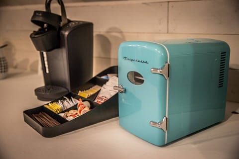 An additional Keurig and mini fridge make it easy for guests to access beverages from the upstairs living space.