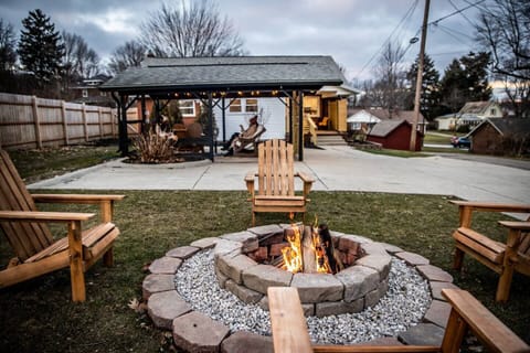 Cozy up by the fire pit with starter firewood provided. 