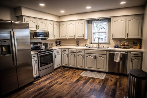 The updated kitchen has plenty of cooking space with new appliances and essential cookware.  The cupboards are stocked with popular spices and olive oil for cooking needs along with dish towels, paper towels, dish soap, hand soap, and dish detergent.