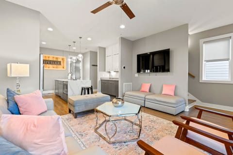 Enjoy your favorite movies, sports, and shows on Casa Rosalie’s living-room TV. This cozy living room provides extra sleeping space with two twin pull-out beds