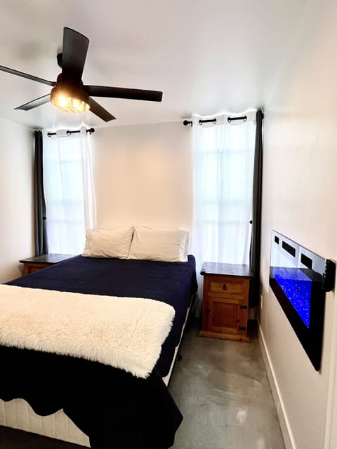 One bedroom with a tempur-pedic mattress with luxurious hotel brand pillows.