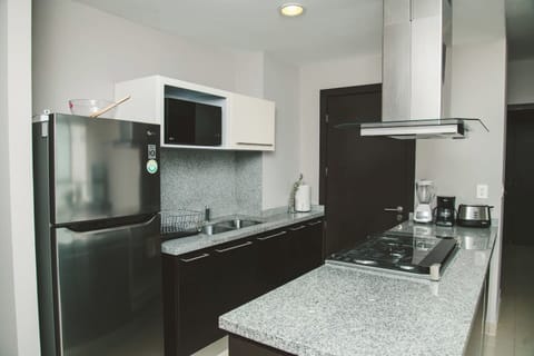 Our small kitchen is fully equipped with state-of-the-art appliances, providing you with everything you need for your culinary endeavors. Prepare delicious meals with ease and efficiency, thanks to the modern features and functionality of the kitche