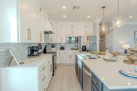 Luxury kitchen blending modern style with coastal charm.