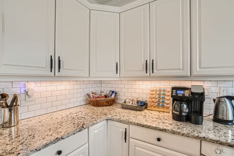 S'mores and hot chocolate station along with k-cups and carafe coffee maker. 