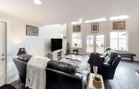 Downstairs Living Room area with water views of the Pond