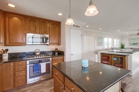 Dine in style with a kitchen that has modern appliances and beautiful finishes.