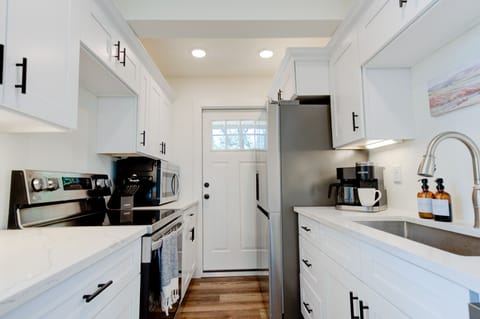 New, clean kitchen with enough to kitchenware for you and your guests