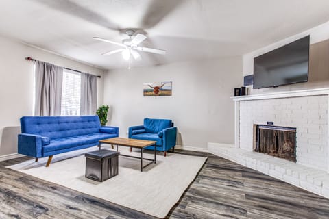 Unwind on the Cozy Blue Sofa & Armchair, While Watching Your Favorite Movie