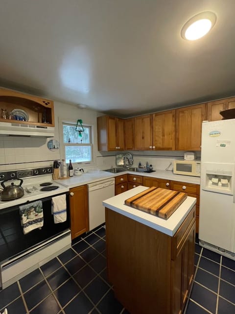 Our kitchen is fully stocked with dishes and cookware.