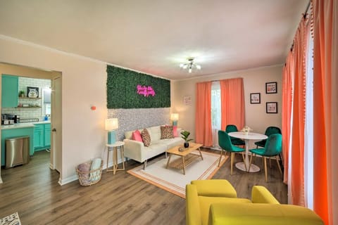 Upstairs living/dining combo with futon, smart TV and photo op w/ light-up neon!