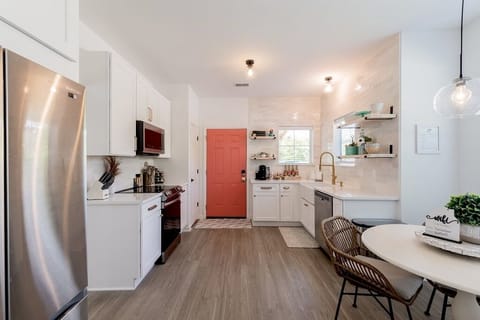 Farmhouse sink, coffee bar, and beautiful windows to let the SC sunshine in!