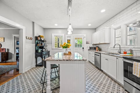 The well- stocked kitchen is equipped with everything you need to make a home cooked meal. It is a great place to gather and talk about your day while sipping on your favorite bourbon.