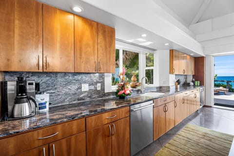 Well-equipped kitchen with granite counters, full-size appliances, and everything needed for effortless meals.