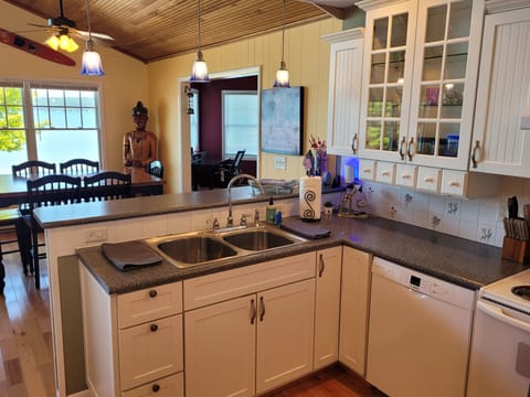 KITCHEN (SECOND FLOOR):  The home has a large kitchen with all appliances including a dishwasher.  Also includes a good supply of cooking and dining utensils.