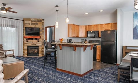 Kitchen area (with glimpse of the living space)