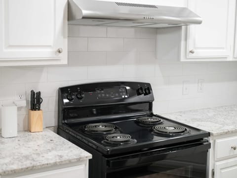 Kitchen offers modern appliances and all the cookware you need