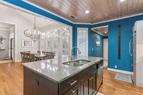 Your stylish kitchen island with granite countertops opens to a bright dining area, perfect for preparing meals and gathering with loved ones.