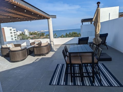 Private rooftop terrace.  Adjustable umbrella ensures shade as needed.