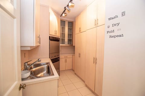 Laundry area with washer, dryer, sink & lots of storage!