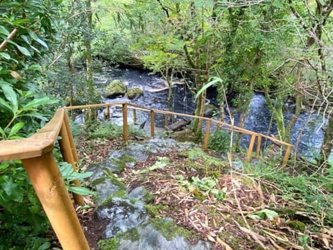Rustic steps down to our private riverside decking. 