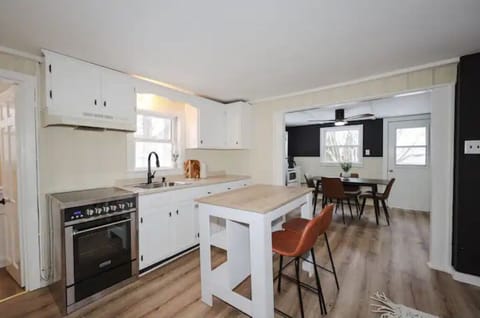Kitchen with island and barstools