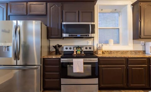 All stainless appliances, including an electric stove.