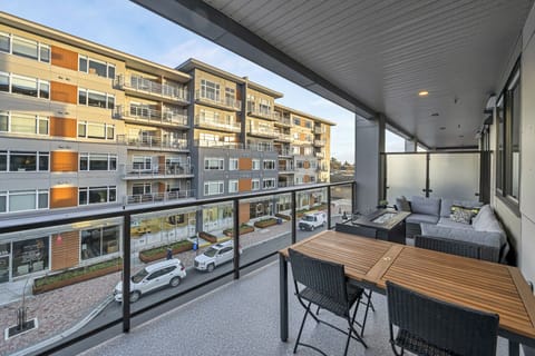 Large 8x20 covered deck has lounging sectional, fire-pit and full dining areas. 