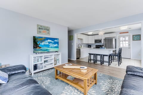 The Living Area is Open to the Dining Area & Entrance to the Kitchen; the Hallway leads to the Bedrooms & Bathrooms.