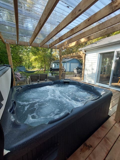 Relaxing six-person hot tub overlooking the beautiful property