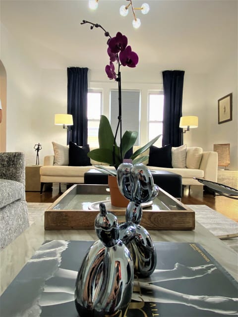 Spacious bright cozy modern living room with designer furniture.