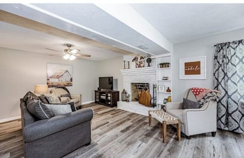 Living room with queen sofa bed and fireplace