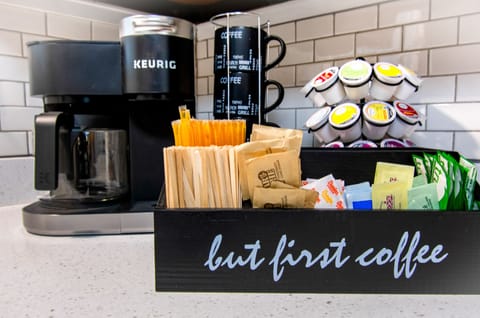 Coffee & tea station w/ coffee pods, sweeteners and creamers provided.