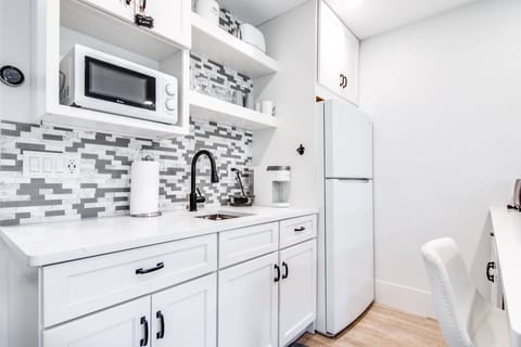 Kitchen includes a refrigerator, microwave, Keurig pod coffee maker, toaster, electric plug-in cooktop & many more!