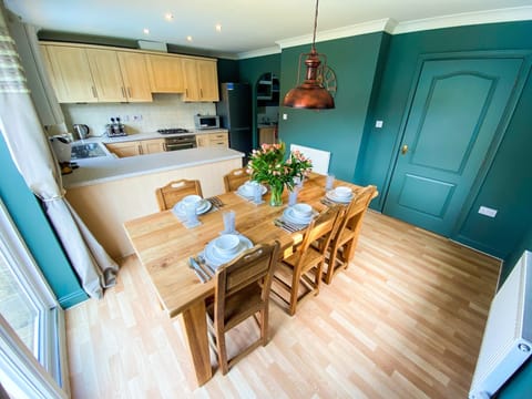 Dining/Kitchen/Utility. Kitchen table can seat 8 guests.