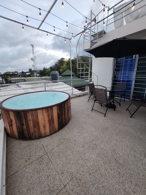 Terrace with private Jacuzzi and outdoor furniture
