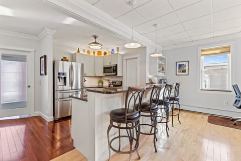 Enjoy an open-concept kitchen with full-sized breakfast bar.