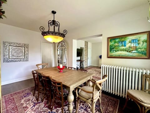 Original art and unique decor add to the Euro-charm this apartment exudes