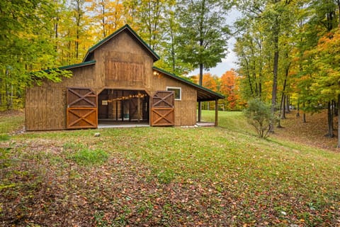 A stunning barn backdrop surrounded by nature—one of many special spaces that make this property truly unique.